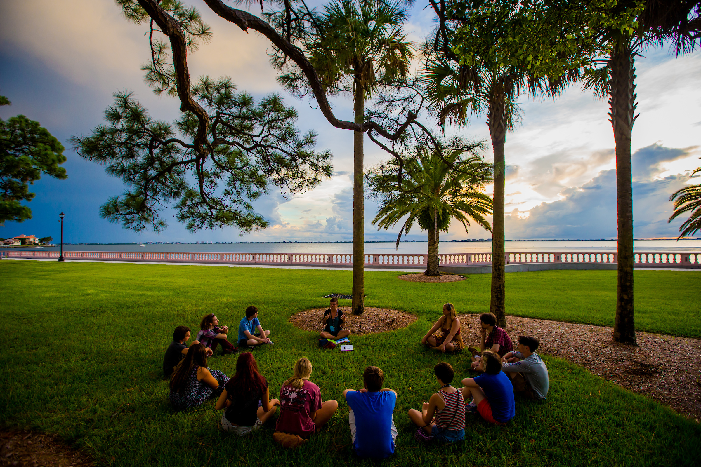 SARASOTA, FL - August 15, 2015 -- Students, parents, and alumni gather at sunset along the bayfront during orientation weekend at New College of Florida for the 2015-2016 academic year.  (PHOTO / CHIP LITHERLAND)